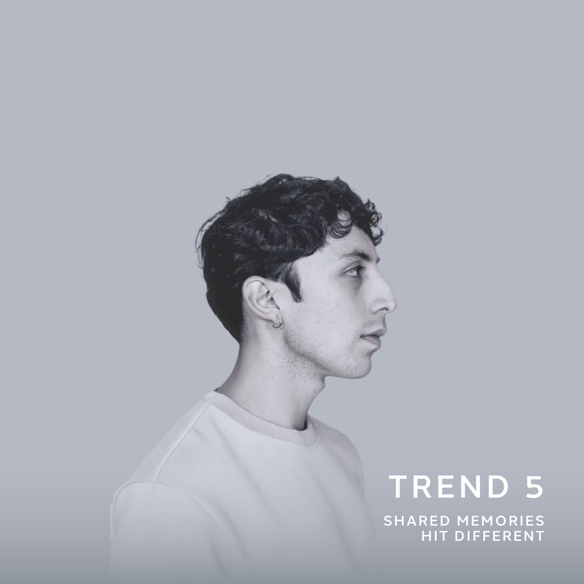 A side-profile portrait of a young man with short curly dark hair, wearing a light sweatshirt, set against a muted grey background. Text on the image reads “Trend 5 – Shared Memories Hit Different.”